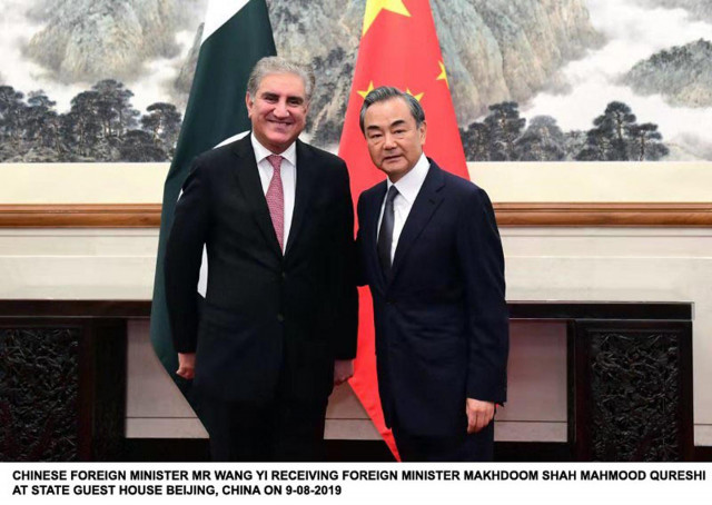 foreign minister shah mehmood qureshi with chinese counterpart wang yi in beijing photo pid foreign minister shah mehmood qureshi with chinese counterpart wang yi in beijing photo pid