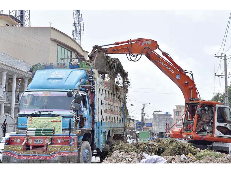 rwmc staff lifts garbage on day two of eidul azha photo app