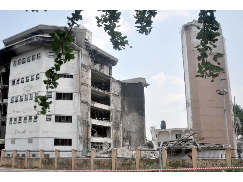 view of the fallen portion of the abandoned awami markaz building in islamabad photo express