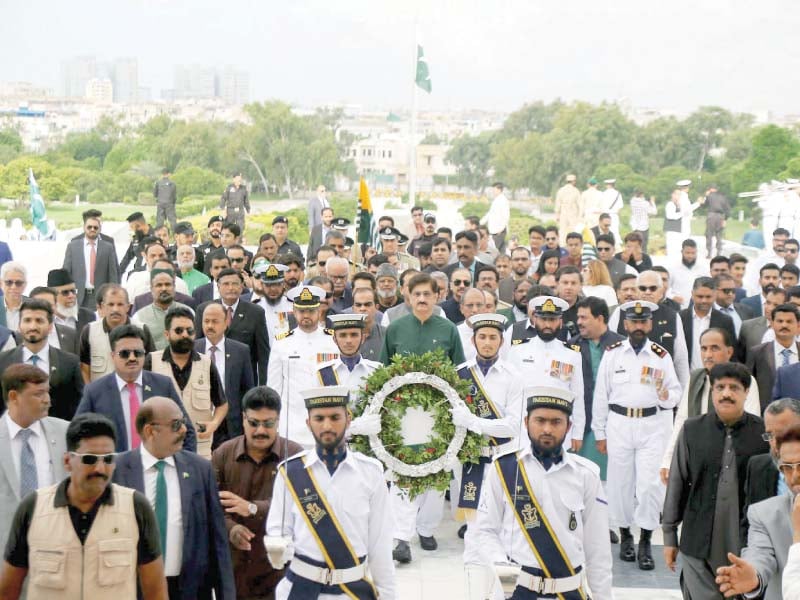 sindh chief minister syed murad ali shah was among other officials who visited the quaid s mausoleum on wednesday to pay tribute to the father of the nation on independence day photo ppi