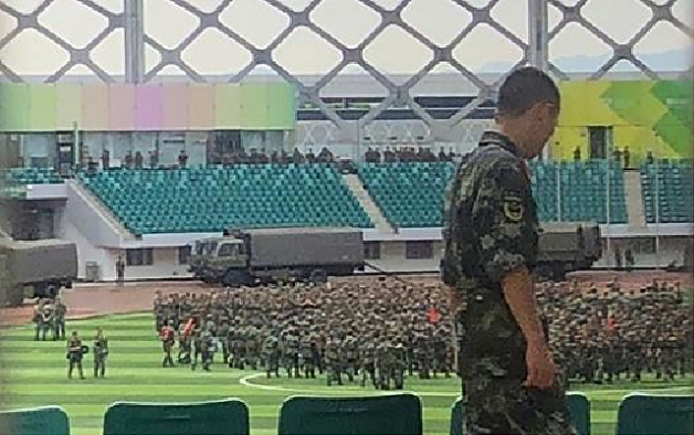 military personnel parade inside the stadium photo afp
