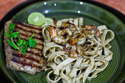 seafood cravings lemon drizzled grilled fish steak served with lightly spiced jumbo prawns on pesto fettuccine seafood cravings lemon drizzled grilled fish steak served with lightly spiced jumbo prawns on pesto fettuccine