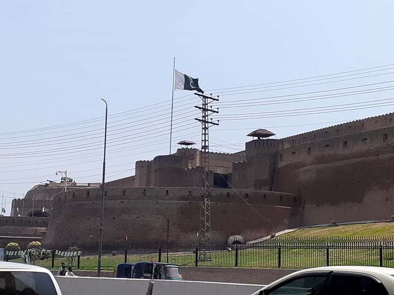 the pakistani flag flies at half mast on the bala hissar fort photo afp