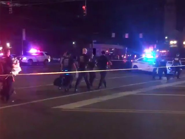 police cordon off a nightlife district in dayton ohio following a mass shooting there photo afp