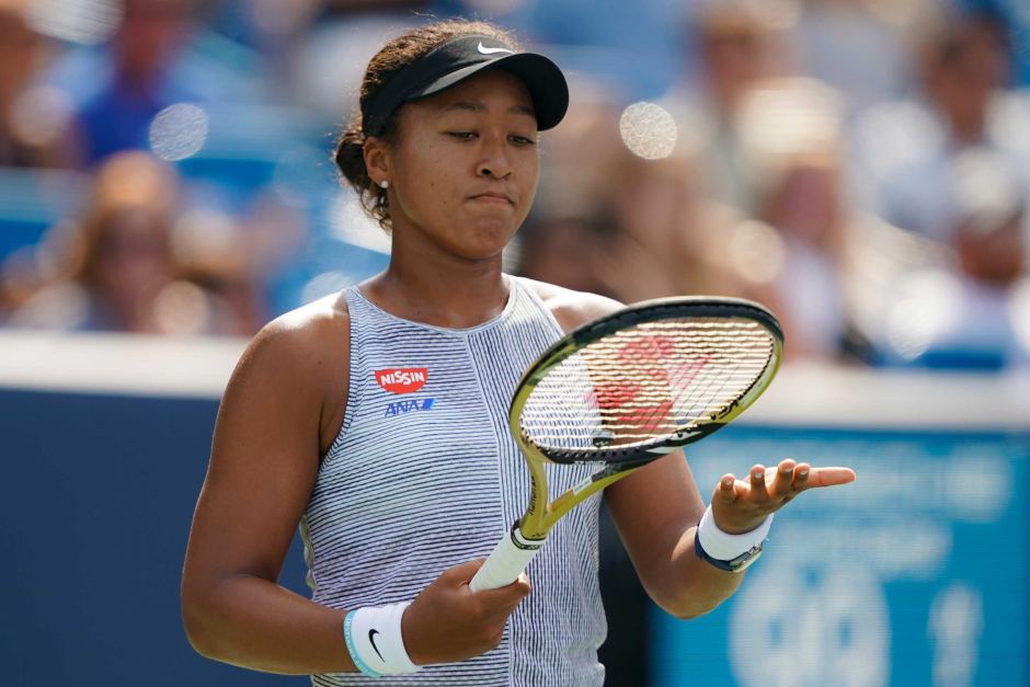 the japanese star who could lose her world number one ranking if australian ashleigh barty wins her semi final on saturday was forced to quit in pain    american sofia kenin a 6 4 1 6 2 0 win photo afp