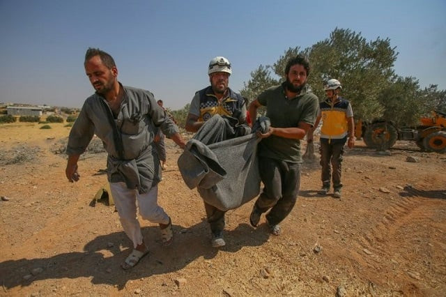 syrian rescuers carry the victim of reported syrian regime air strikes that hit a village in the country 039 s northwest where a mother and six of her children were killed on august 17 2019 photo afp syrian rescuers carry the victim of reported syrian regime air strikes that hit a village in the country 039 s northwest where a mother and six of her children were killed on august 17 2019 photo afp