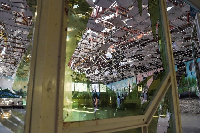afghan men gather in a wedding hall after a deadly bomb blast in kabul photo afp afghan men gather in a wedding hall after a deadly bomb blast in kabul photo afp