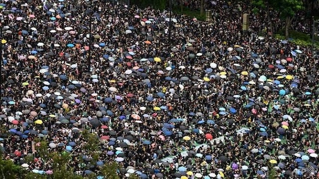 protesters gather for a rally in victoria park in hong kong on aug 18 2019 in the latest opposition to a planned extradition law that has since morphed into a wider call for democratic rights in the semi autonomous city photo afp