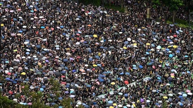protesters gather for a rally in victoria park in hong kong on aug 18 2019 in the latest opposition to a planned extradition law that has since morphed into a wider call for democratic rights in the semi autonomous city photo afp