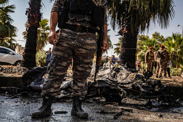 security forces gather at the scene of a car bomb explosion in qamishli photo afp