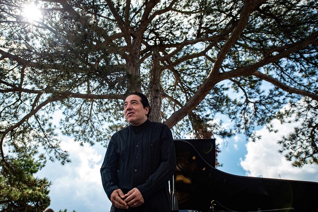 turkish pianist and composer fazil say acknowledges the audience at a concert against deforestation on the site a controversial gold photo afp