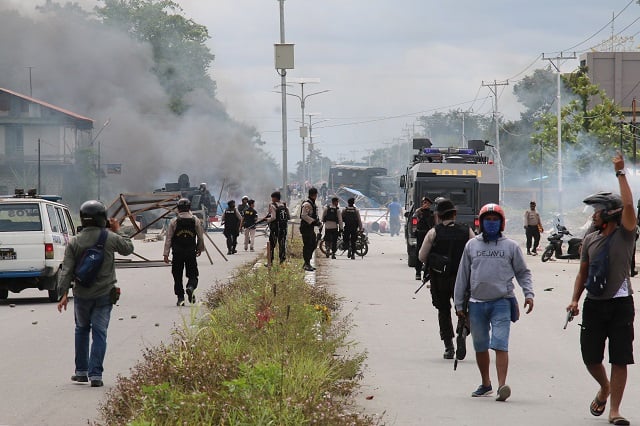 indonesian policemen disperse protesters in timika indonesia 039 s restive papua province photo afp