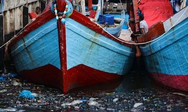fishing boats sit in trash filled waters in banda aceh indonesia on july 16 2019 photo afp fishing boats sit in trash filled waters in banda aceh indonesia on july 16 2019 photo afp