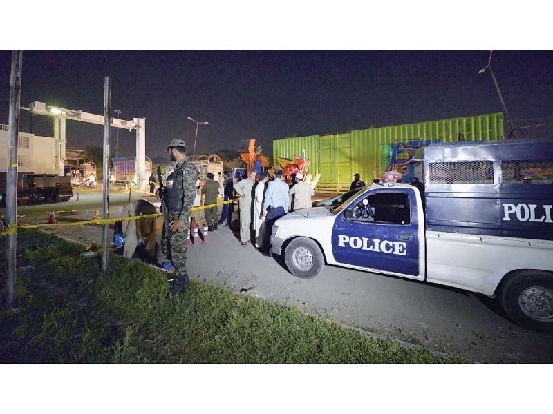 police cordon off the area where two policemen were killed and on injured while manning the scanner vehicle photo online