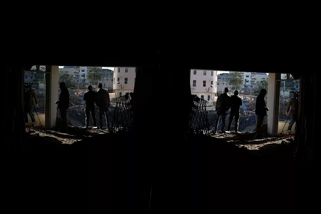 palestinians are seen reflected in a mirror near the office of hamas chief ismail haniyeh after it was destroyed by an israeli air strike in gaza city in march 2019 photo reuters palestinians are seen reflected in a mirror near the office of hamas chief ismail haniyeh after it was destroyed by an israeli air strike in gaza city in march 2019 photo reuters