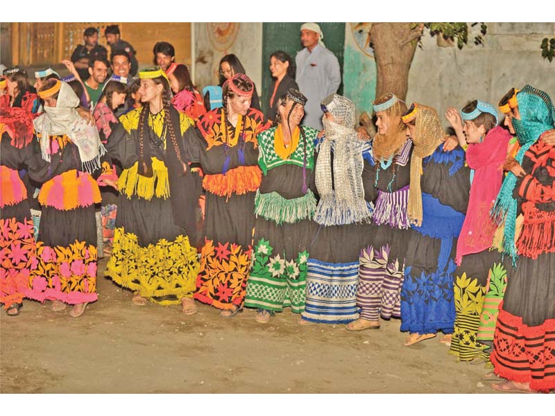 kalash women decked in their traditional attire dance during the uchau festival photo express