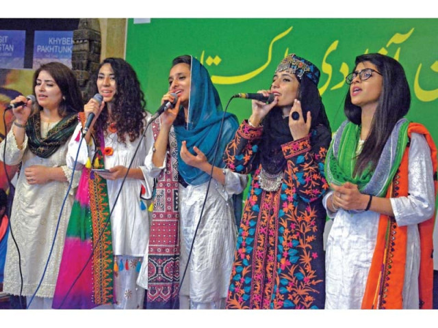 students sing national songs at an independence themed event at lok virsa photo zafar aslam express