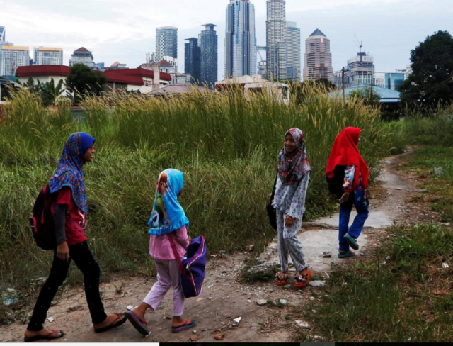 girls make their way home after school in kuala lumpur malaysia photo reuters