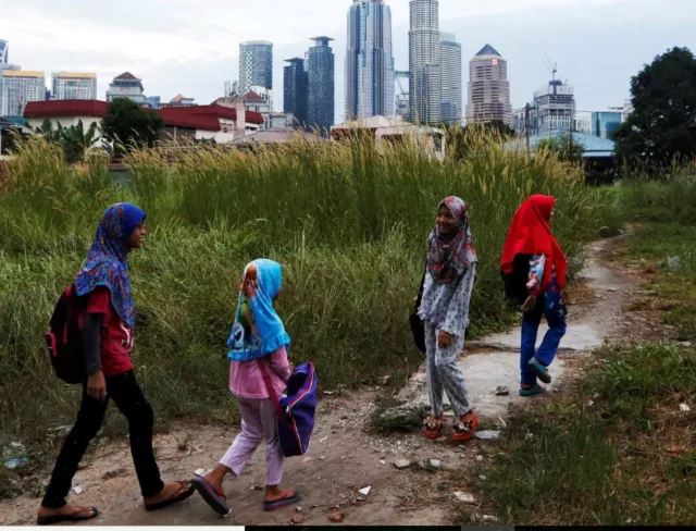 girls make their way home after school in kuala lumpur malaysia photo reuters girls make their way home after school in kuala lumpur malaysia photo reuters
