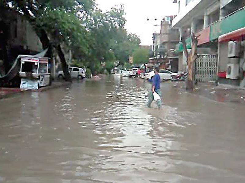 overflowing gutters force locals to wade in filth