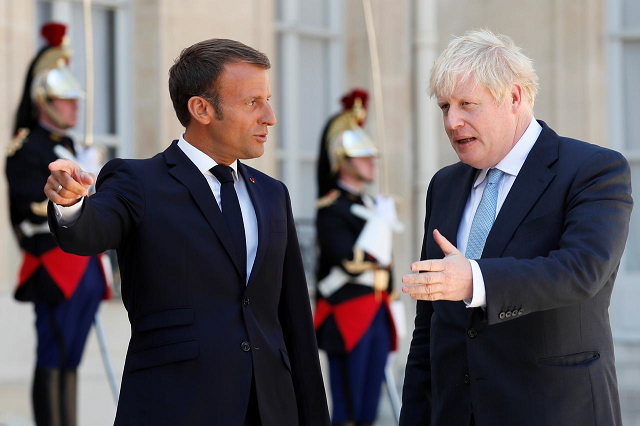 french president emmanuel macron welcomes british prime minister boris johnson before a meeting on brexit at the elysee palace in paris france august 22 2019 photo reuters