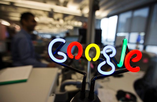 a neon google logo is seen as employees work at the new google office in toronto november 13 2012 photo reuters