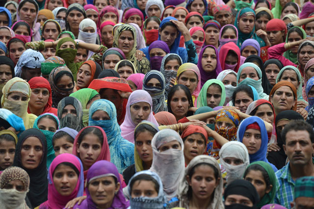 kashmiri mourners look on during the funeral of four civilians at aripanthan magam village in budgam district on the outskirts of srinagar on august 16 2016 photo afp file