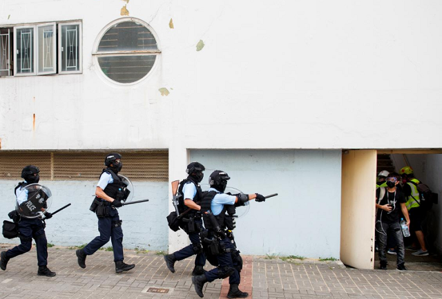 police chase after protesters in ngau tau kok in hong kong china photo reuters police chase after protesters in ngau tau kok in hong kong china photo reuters