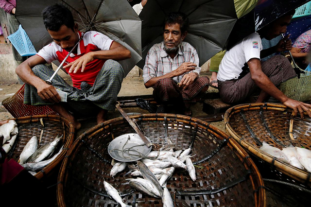 muslim vendors sell fish in the market of maungdaw rakhine july 9 2019 photo reuters muslim vendors sell fish in the market of maungdaw rakhine july 9 2019 photo reuters