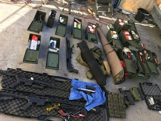 guns ammunition and tactical gear seized by police near los angeles after arresting a man who threatened a mass shooting photo afp