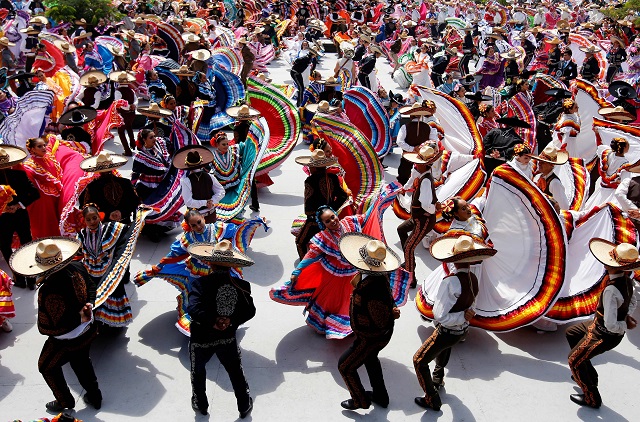 couples dance to mariachi traditional music to break the guinness world record of largest mexican folk dance dancers in guadalajara mexico photo afp