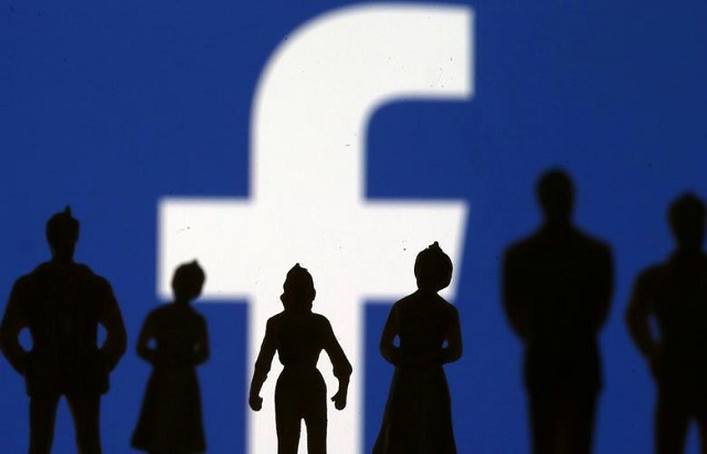 small toy figures are seen in front of facebook logo in this illustration picture april 8 2019 photo reuters