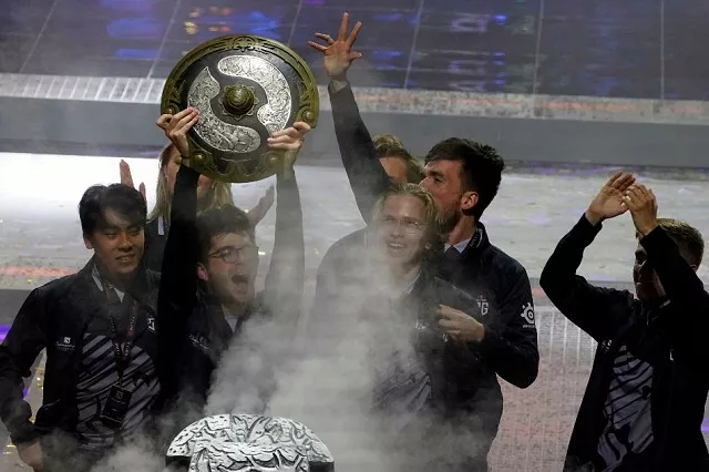 team og celebrate after winning the final against team liquid at the international dota 2 world championships at the mercedes benz arena in shanghai china august 25 2019 photo reuters