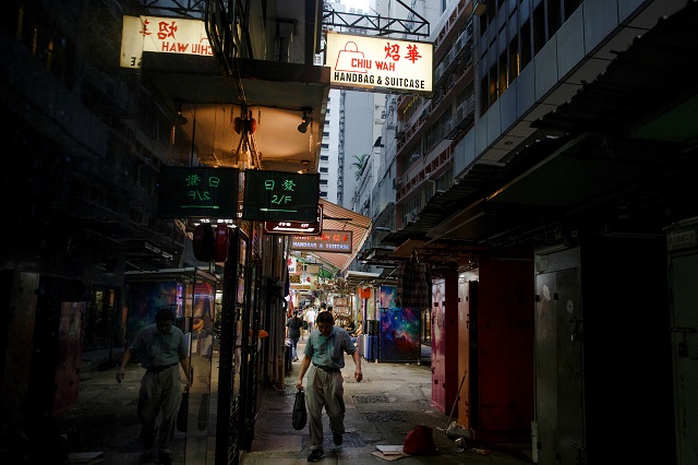 a man walks between stalls in an alley in the central business district in hong kong china august 22 2019 photo reuters