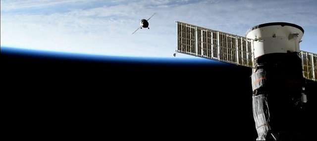 the soyuz ms 14 spacecraft is pictured during it s approach the soyuz ms 13 is seen in the forground photo nasa the soyuz ms 14 spacecraft is pictured during it s approach the soyuz ms 13 is seen in the forground photo nasa