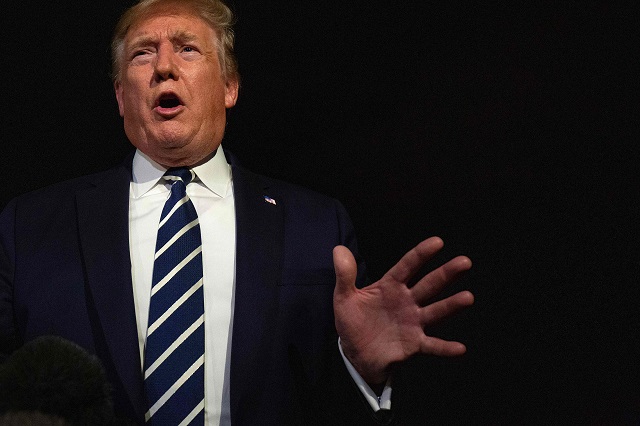 president donald trump gestures as he speaks to the press while departing the white house in washington dc for the g7 summit in france on august 23 2019 photo afp