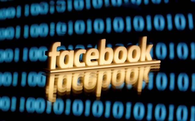 a 3 d printed facebook logo is seen in front of displayed binary code in this illustration picture june 18 2019 photo reuters a 3 d printed facebook logo is seen in front of displayed binary code in this illustration picture june 18 2019 photo reuters