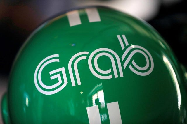 a grab motorbike helmet is displayed during grab 039 s fifth anniversary news conference in singapore june 6 2017 photo reuters