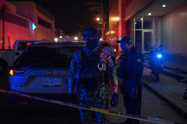 federal forces keep watch at a crime scene following a deadly attack at a bar photo reuters