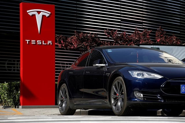 the logo of tesla car maker is seen photo reuters the logo of tesla car maker is seen photo reuters