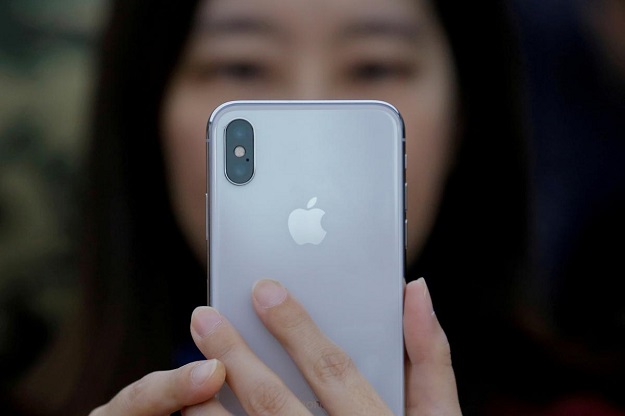 a attendee uses a new iphone x during a presentation for the media in beijing china october 31 2017 photo reuters