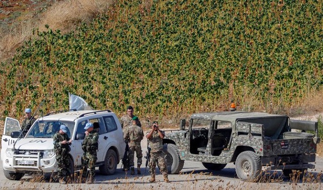 a picture taken from the israeli side of the border with lebanon on august 27 2019 shows lebanese army and united nations interim forces in lebanon unifil vehicles patrolling in the lebanese village of aitaroun along the the israeli side of the border with lebanon i lebanese border photo afp