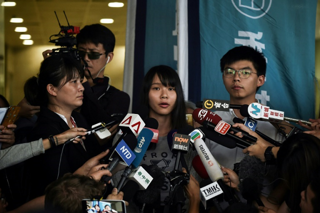 joshua wong and agnes chow two of the umbrella movement 039 s leaders are still well regarded among the hong kong youth photo afp