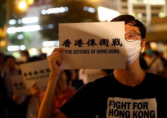 a man covers his eye with a placard as he attends a protest in hong kong china august 30 2019 photo reuters a man covers his eye with a placard as he attends a protest in hong kong china august 30 2019 photo reuters