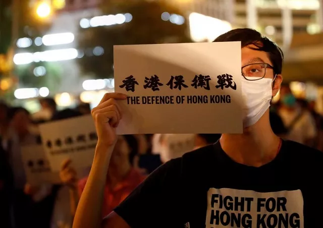 a man covers his eye with a placard as he attends a protest in hong kong china august 30 2019 photo reuters a man covers his eye with a placard as he attends a protest in hong kong china august 30 2019 photo reuters