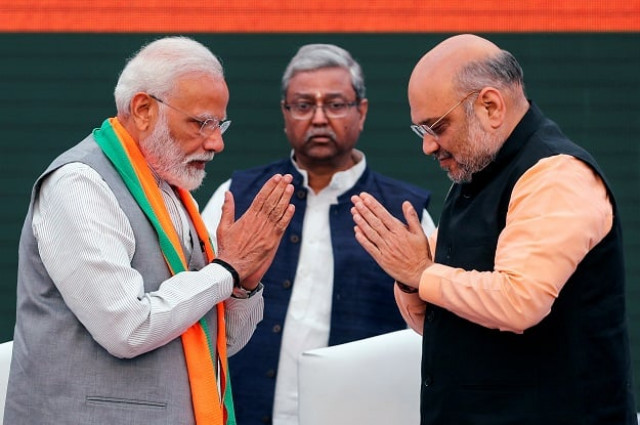 indian prime minister narendra modi and chief of india 039 s ruling bharatiya janata party amit shah greet each other before releasing their party 039 s election manifesto for the general election in new delhi on april 8 2019 reuters file indian prime minister narendra modi and chief of india 039 s ruling bharatiya janata party amit shah greet each other before releasing their party 039 s election manifesto for the general election in new delhi on april 8 2019 reuters file