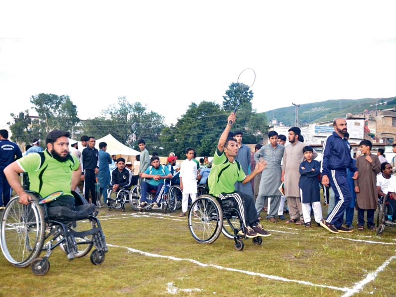 badminton players in action at the international special games being held in abbottabad photo express