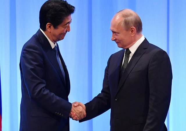 russia 039 s president vladimir putin shakes hands with japan 039 s prime minister shinzo abe during a news conference after the g20 summit in osaka japan photo reuters
