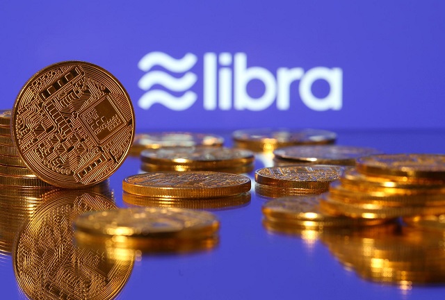 representations of virtual currency are displayed in front of the libra logo in this illustration picture june 21 2019 photo reuters