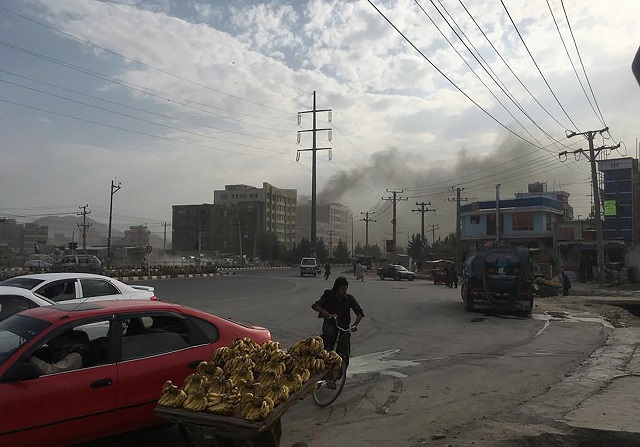 smoke rises from the site of an attack targeting the kabul office of the running mate of afghan president ashraf ghani in kabul on july 28 2019   at least one person was killed and 13 others wounded in an attack july 28 targeting the kabul office of the running mate of afghan president ashraf ghani officials said photo afp